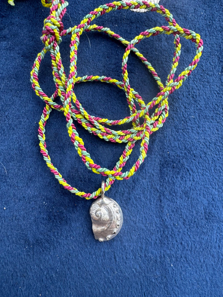 Silver abalone shell on cord