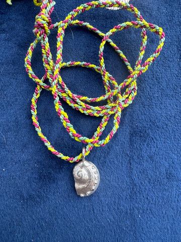 Silver abalone shell on cord